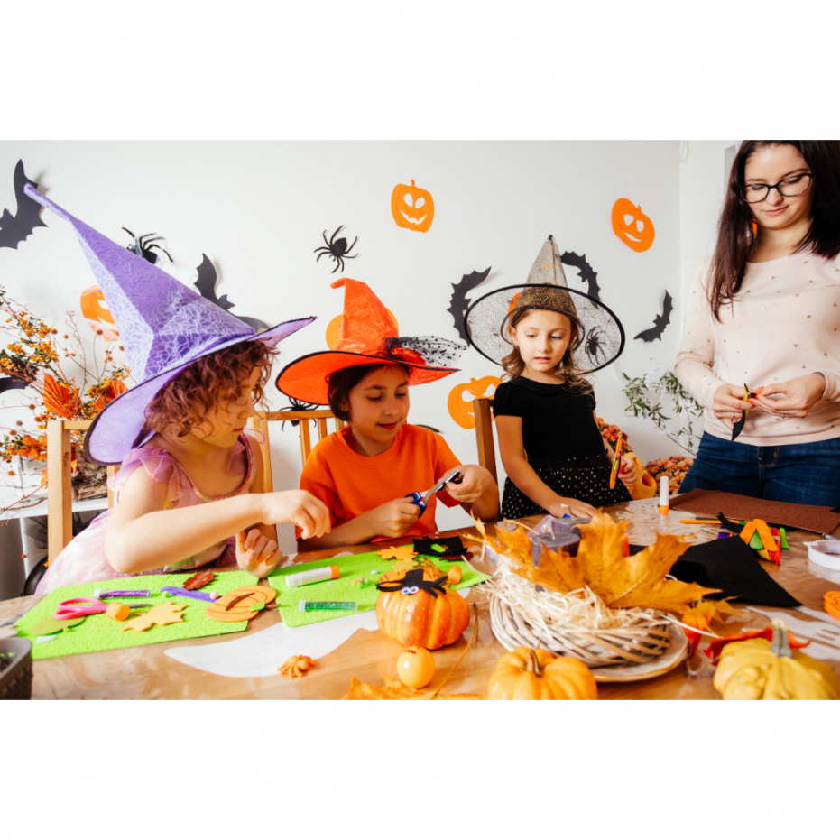 Kids (toddlers) playing with halloween crafts in costumes